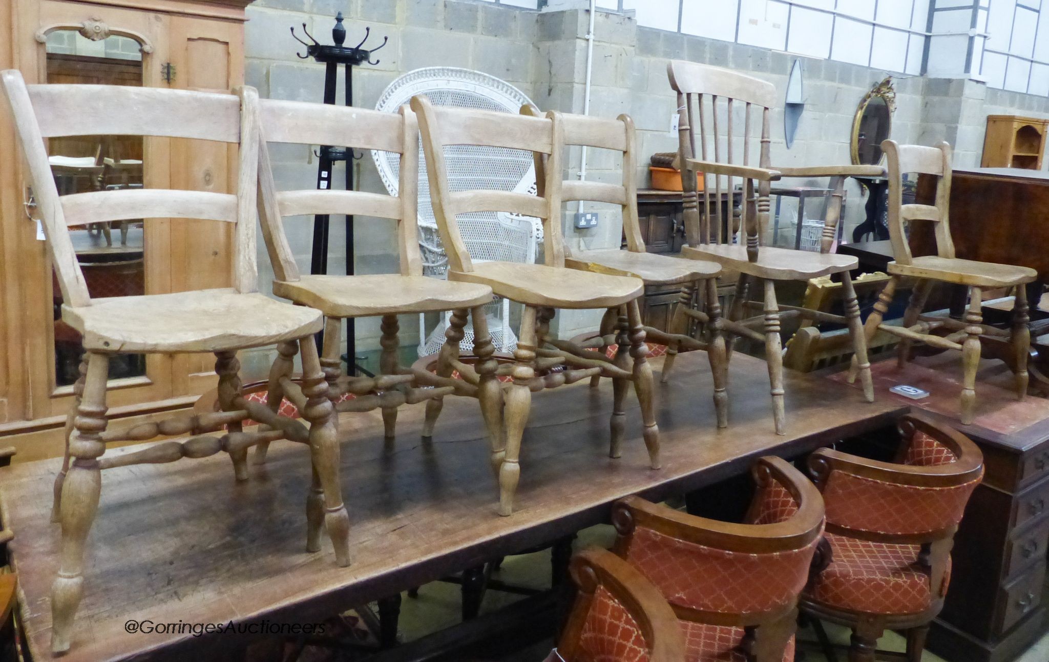 A Victorian elm and beech Windsor elbow chair togehter with five Victorian Windsor kitchen chairs